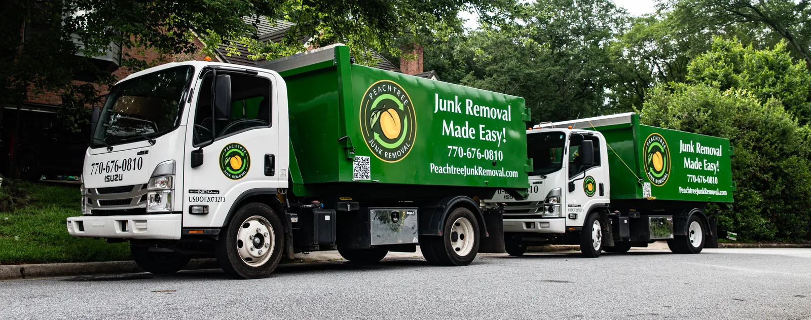 The Peachtree Junk Removal fleet on a Metro Atlanta street