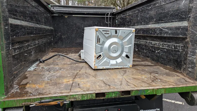 An appliance loaded on a Peachtree Junk Removal truck in Atlanta