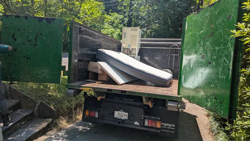 Mattresses loaded on a Peachtree Junk Removal truck on an Atlanta job